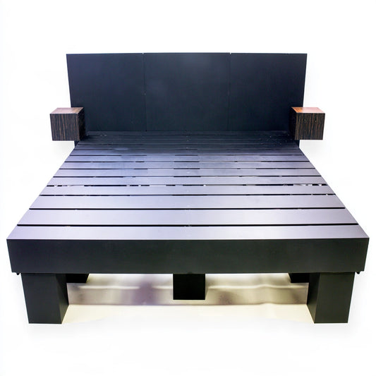 Black powder-coated metal bedframe from MirrorandMist, shown from a high angle in a studio setting.